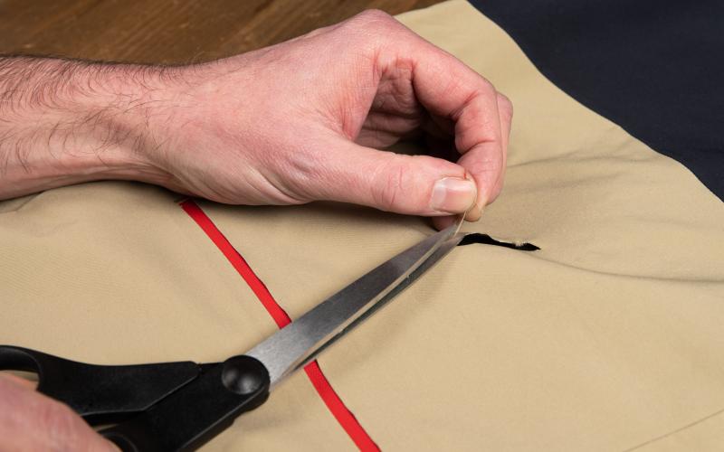 Cutting away loose threads